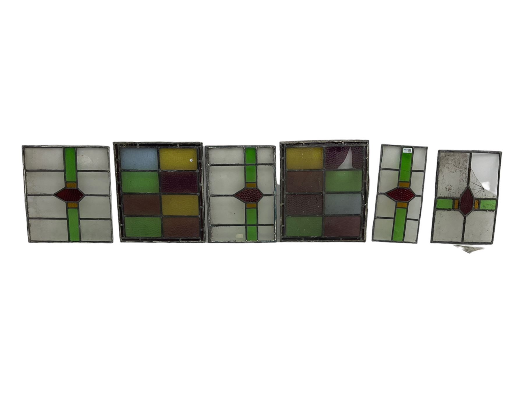 Six leaded stained glass window panes, largest measuring 46cm x 41cm