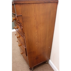  Victorian mahogany and oak bow front chest, two short and four long graduating drawers, turned supports, W122cm, H133cm, D61cm  