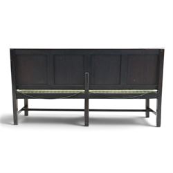 17th century design oak four panelled hall bench, fielded back panels flanked by swept arms on turned supports, raised on six supports united by a stretcher
