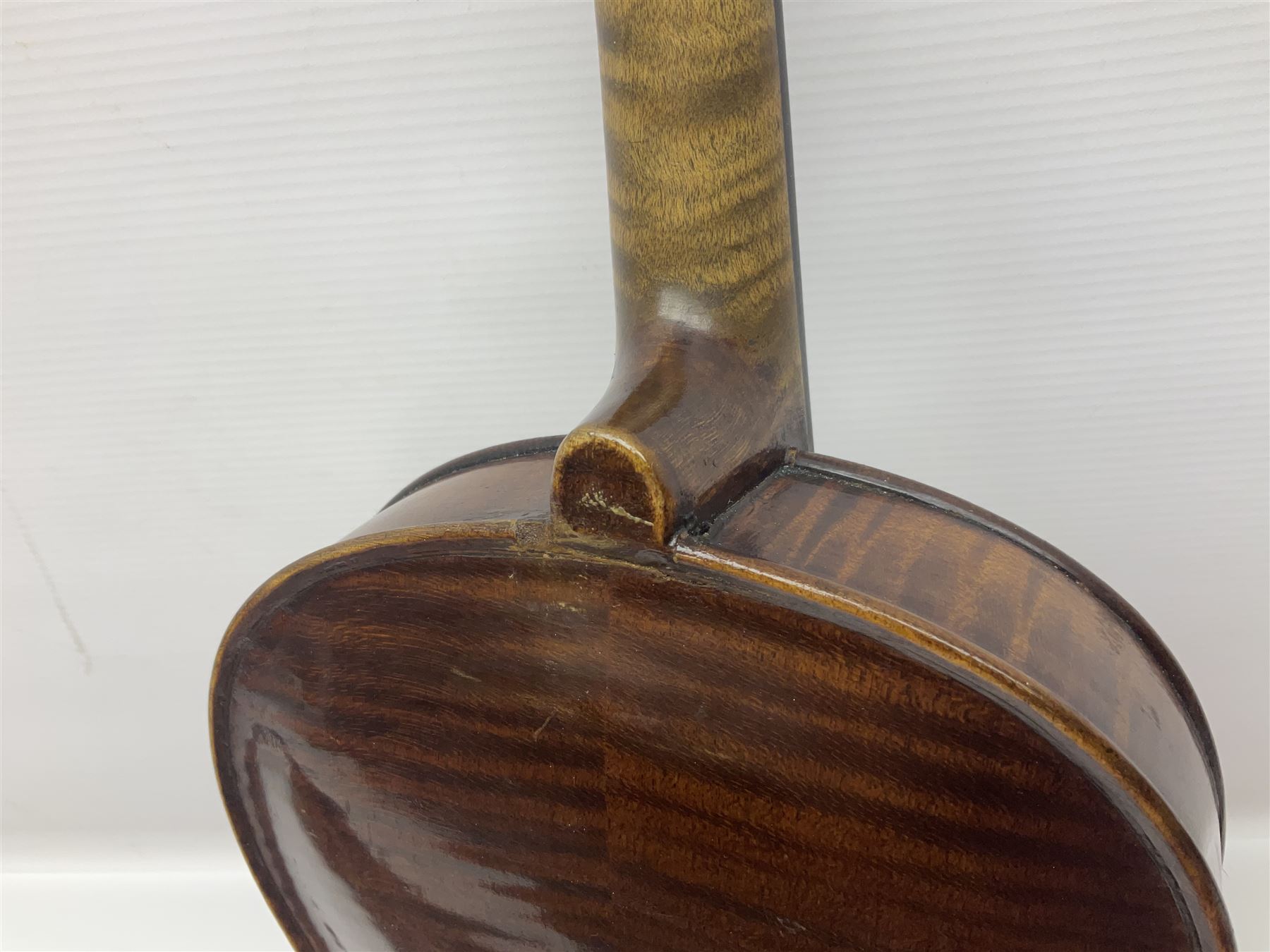 German trade violin in the Steiner style c1900 with 35.5cm two-piece maple back and ribs and spruce top L59cm overall; in fitted carrying case with two bows; and a Saxony violin with 35.5cm one-piece maple back and ribs and spruce top L58.5cm overall (2)