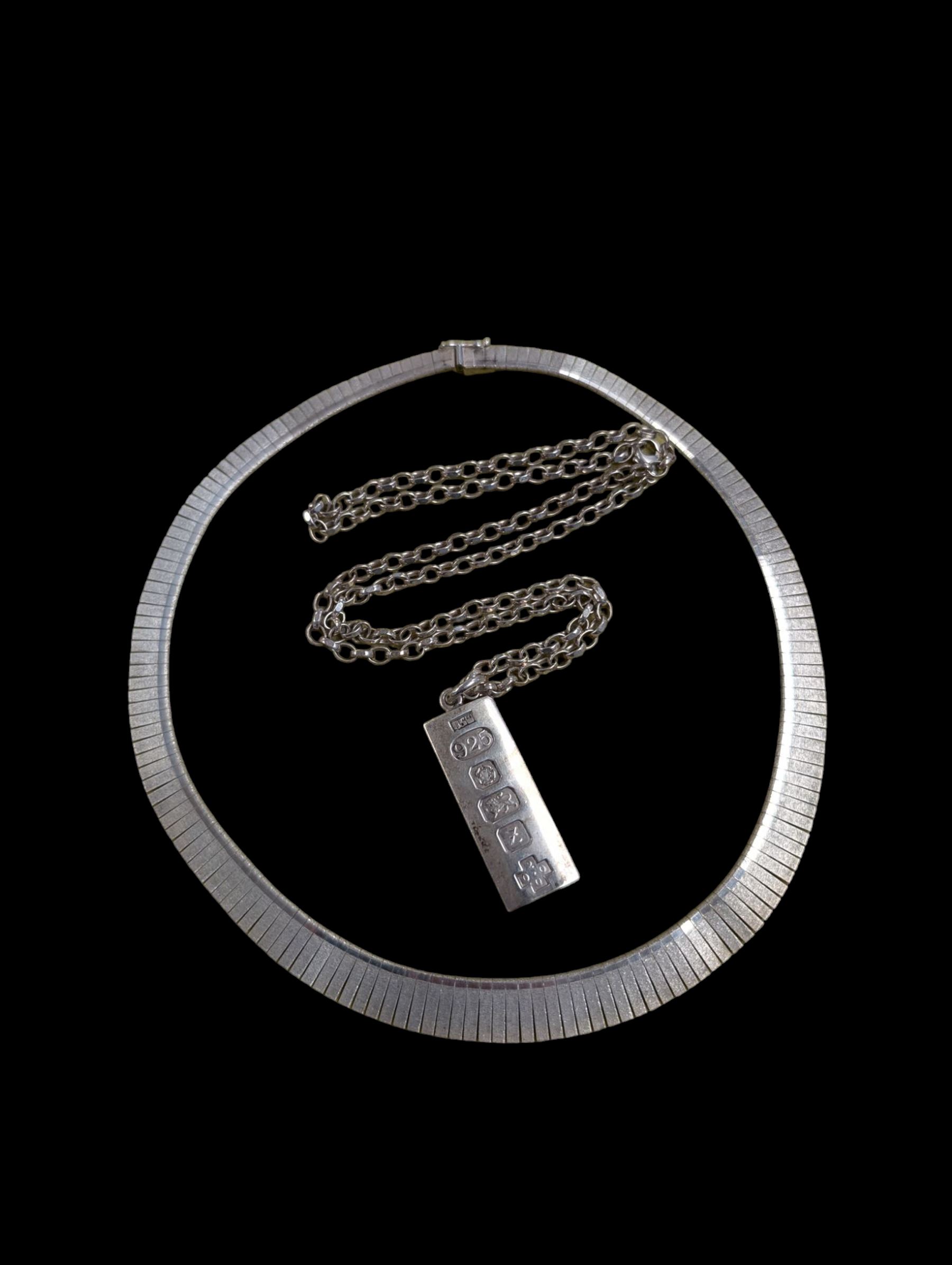 Silver ingot, hallmarked Sheffield 2000, on a silver chain, together with a silver fringe necklace