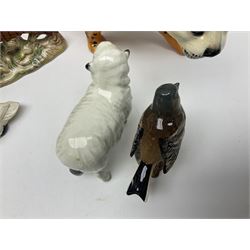Group of Beswick figures to include leopard no 1082, rabbits, swan, pheasant no 1226 etc, all with marks beneath