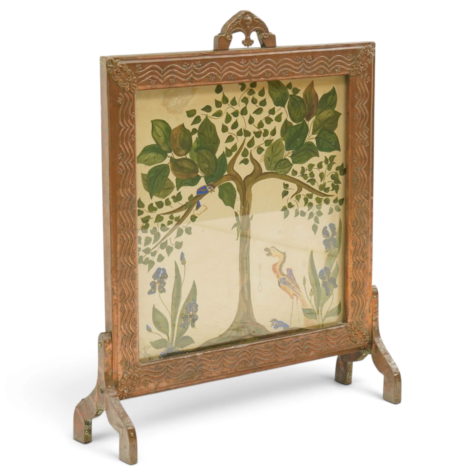 Arts & Crafts copper framed fire screen, the framed decorated in relief with with repeating waves design and floral sprigs to the corners, the central panel painted with stylised birds amongst trees, H80cm  