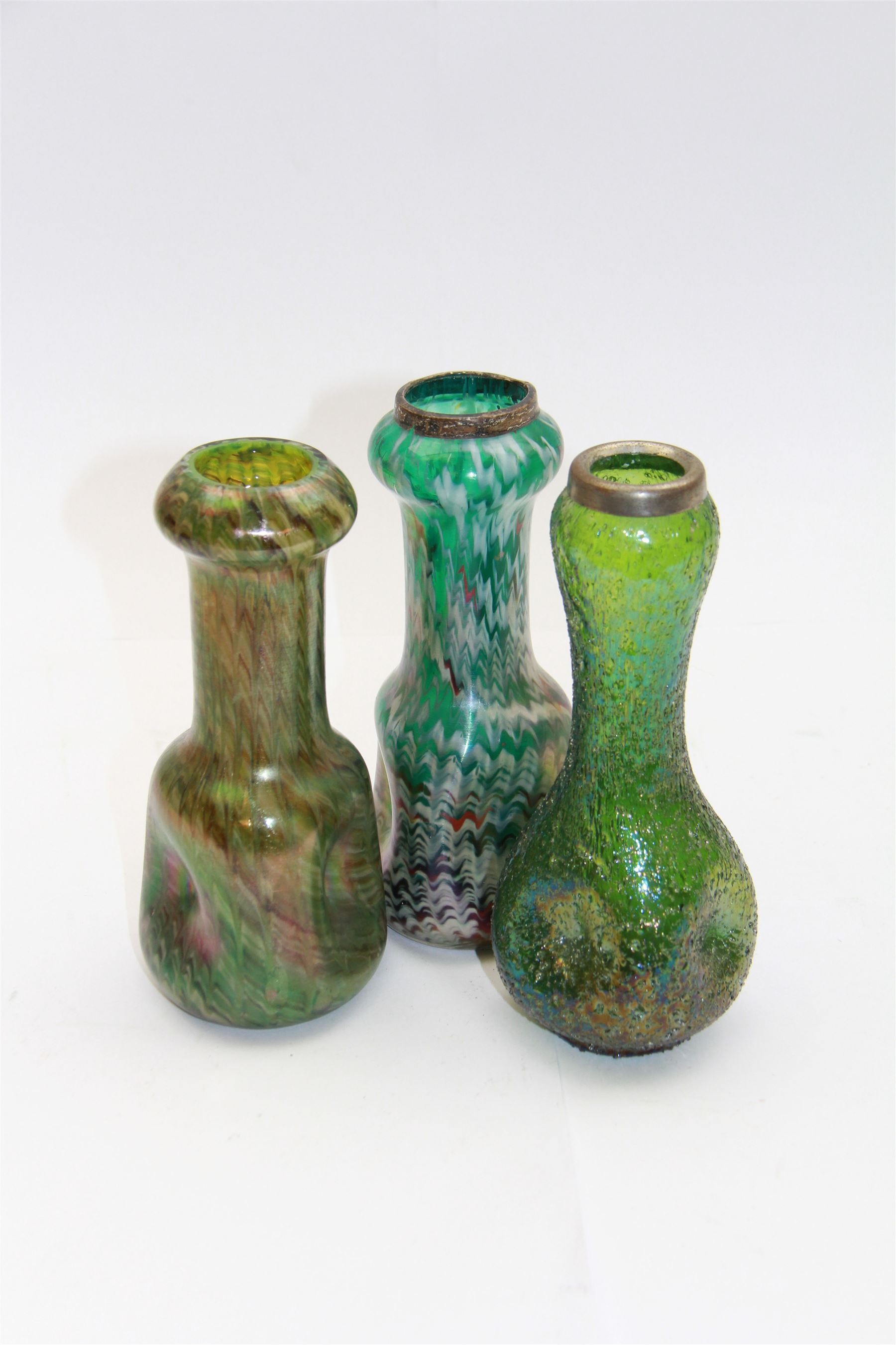 Three Austrian Art Nouveau green iridescent glass bottleneck vases, probably Rindskopf, to include one example with hallmarked silver collar, tallest H18cm (3)