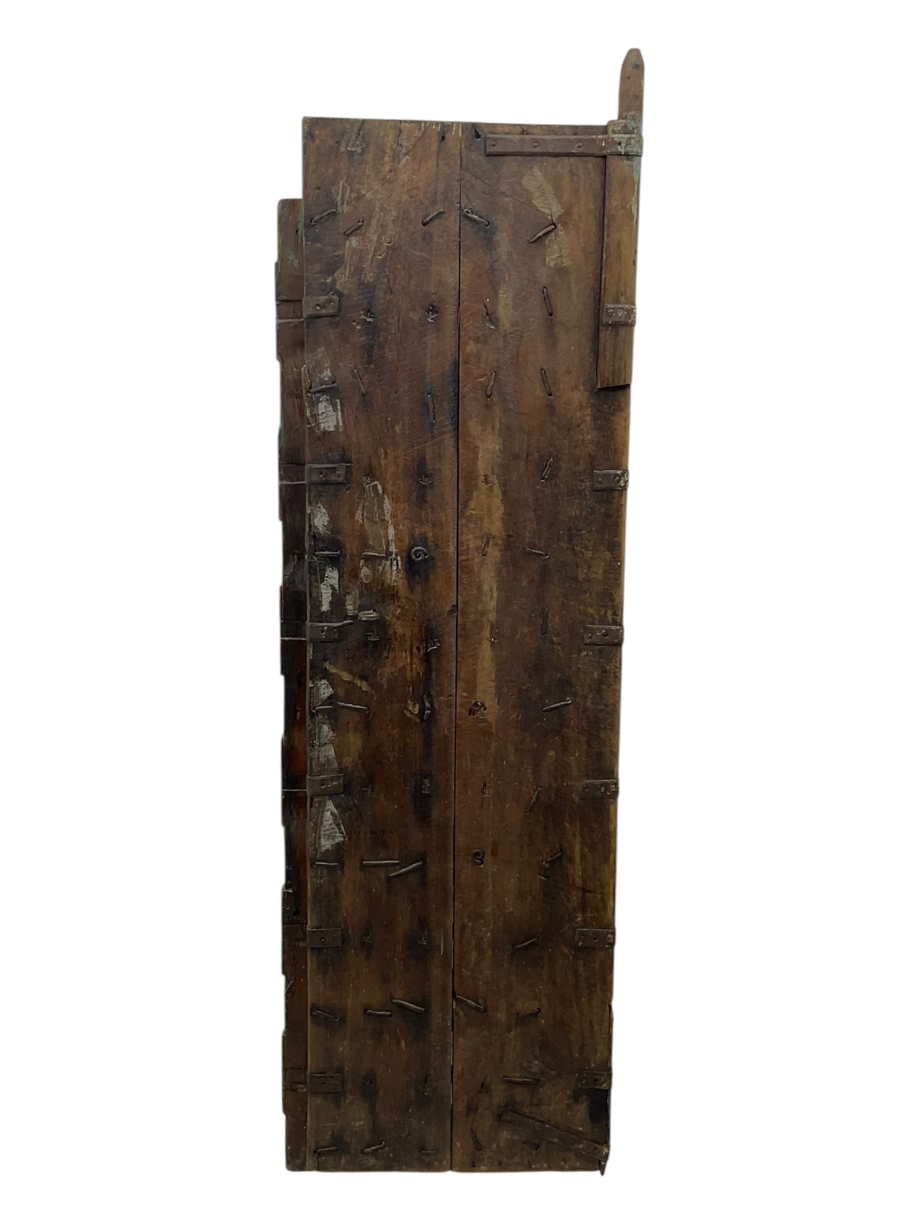 Pair of green-painted Indian doors, c.1860–1880, made from solid teak featuring original iron work and hand-painted finish