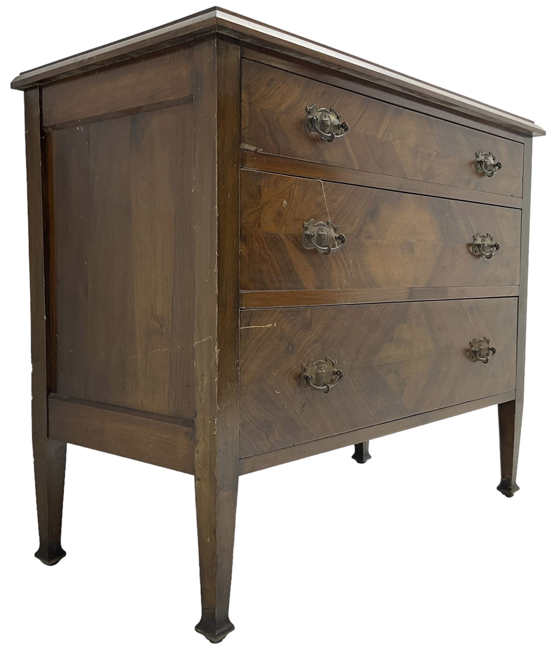 Early to mid-20th century walnut chest, fitted with three graduating drawers with bookmatch veneer facias, raised on square tapering supports