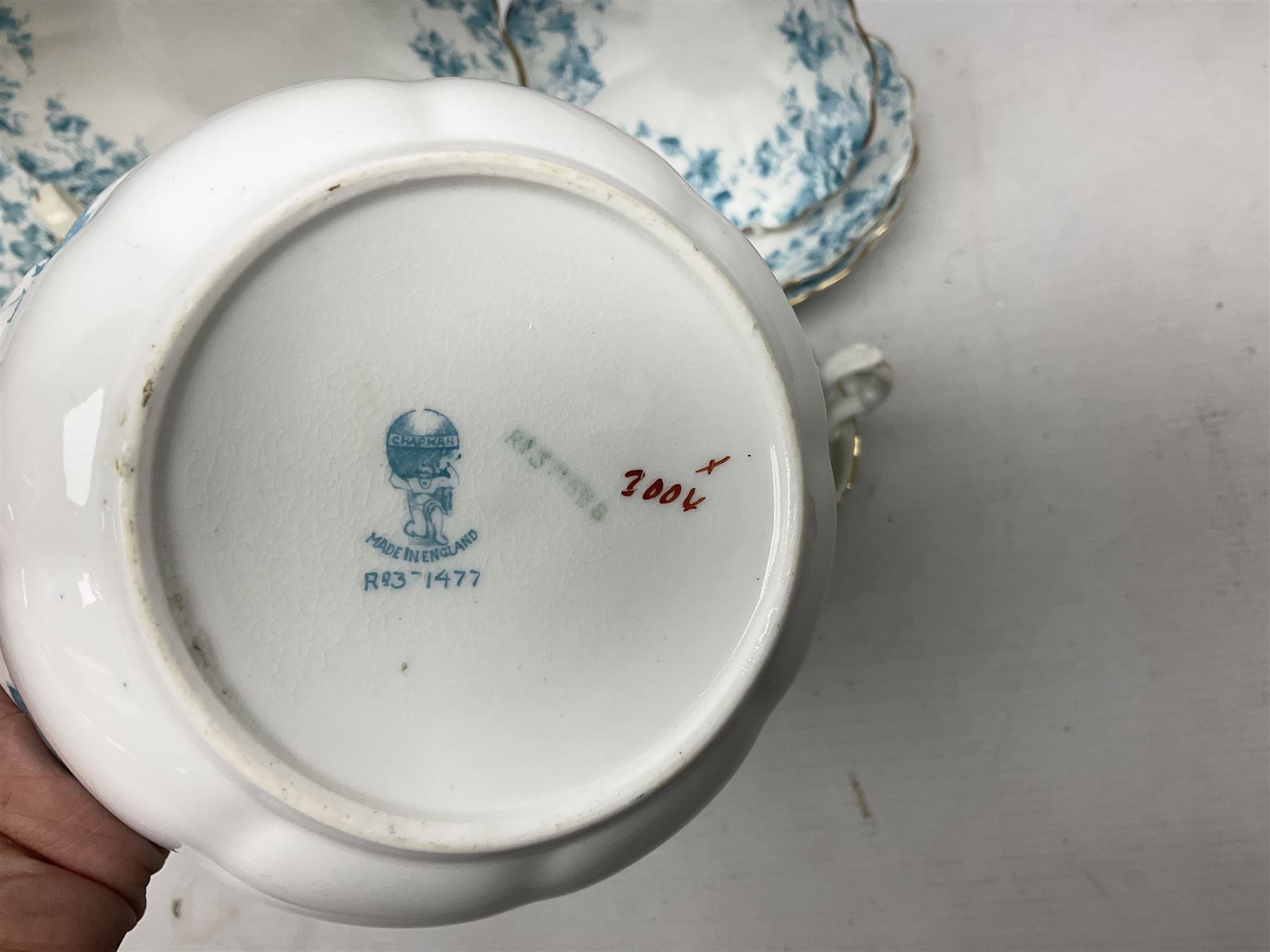 Edwardian David Chapman & Sons tea service for six, of lobed form decorated with blue transfer printed foliate decoration and gilt rims