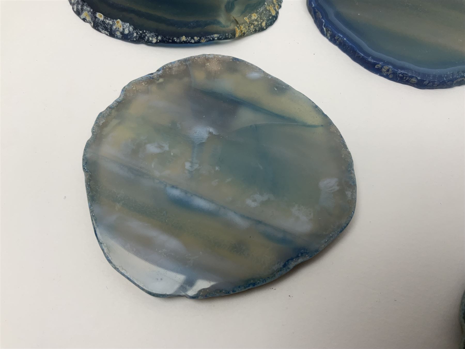 Five blue agate slices, polished with rough edges, H9cm, L7cm