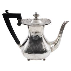 Victorian silver coffee pot, of bellied form with egg and dart rim, with ebonised handle, the cover with urn shaped finial upon four ball feet, hallmarked Henry Matthews, Birmingham 1896, H21cm