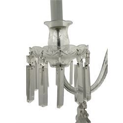 Pair of cut glass two branch wall sconce candelabras, each with S scroll extending branches with shaped and bevelled circular drip trays, hung with pendant drops