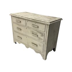 20th century painted pine chest of drawers, rectangular top over two short and two long drawers, scalloped apron, on castors
