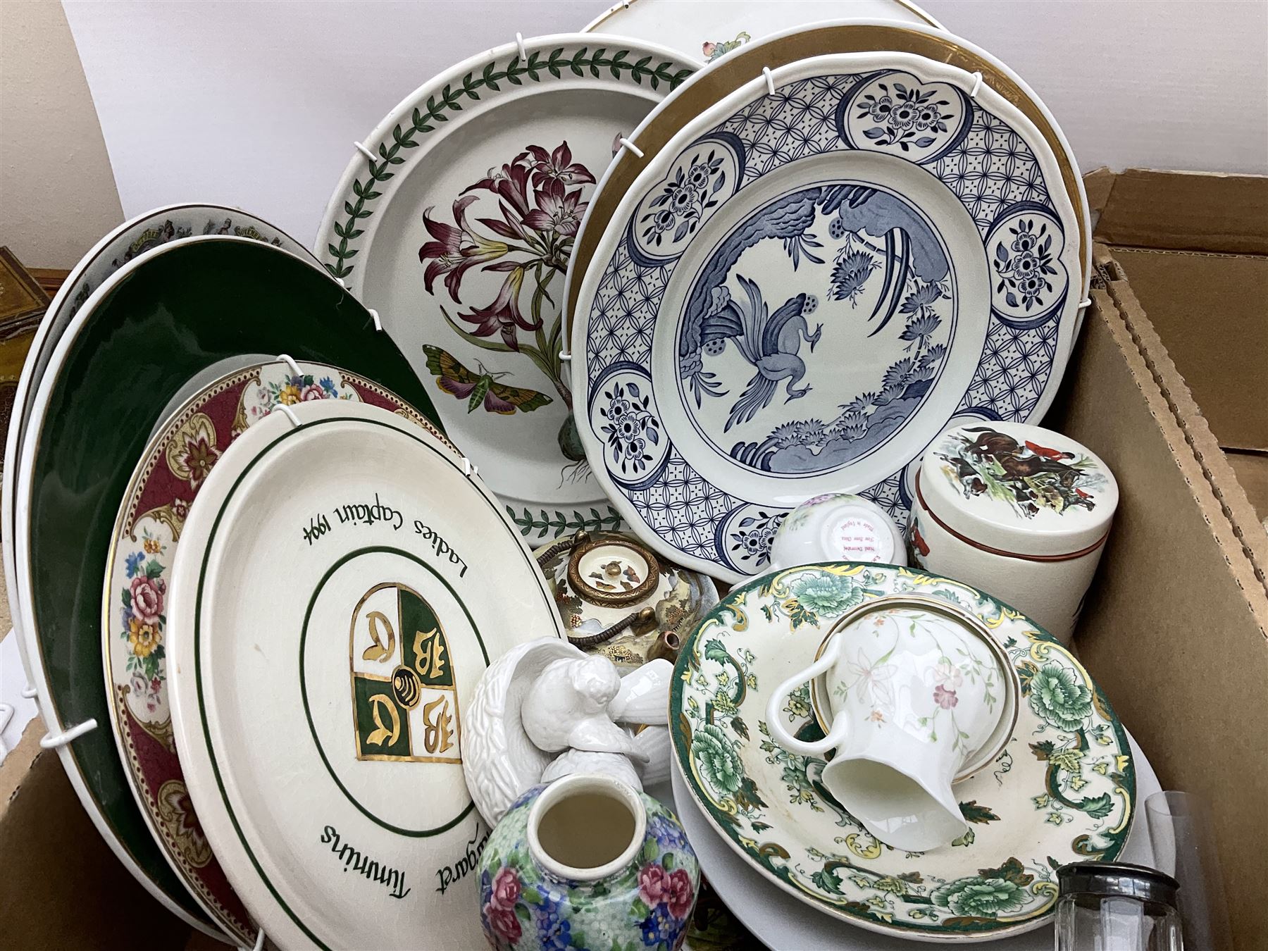 Quantity of various ceramics and glassware to include pair of Disney Mickey and Minnie Mouse cowboy Sherriff figures, stamped Japan beneath, Mason's ironstone, Wedgwood, Portmeirion, tea and dinner wares, collectors plates, glass animals etc in four boxes