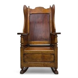 19th-century beech, yew, elm, and mahogany wingback vernacular rocking chair, high back with shaped wings, scroll arms with turned supports, lift-up seat,  square legs on ring turned supports on curved runners 