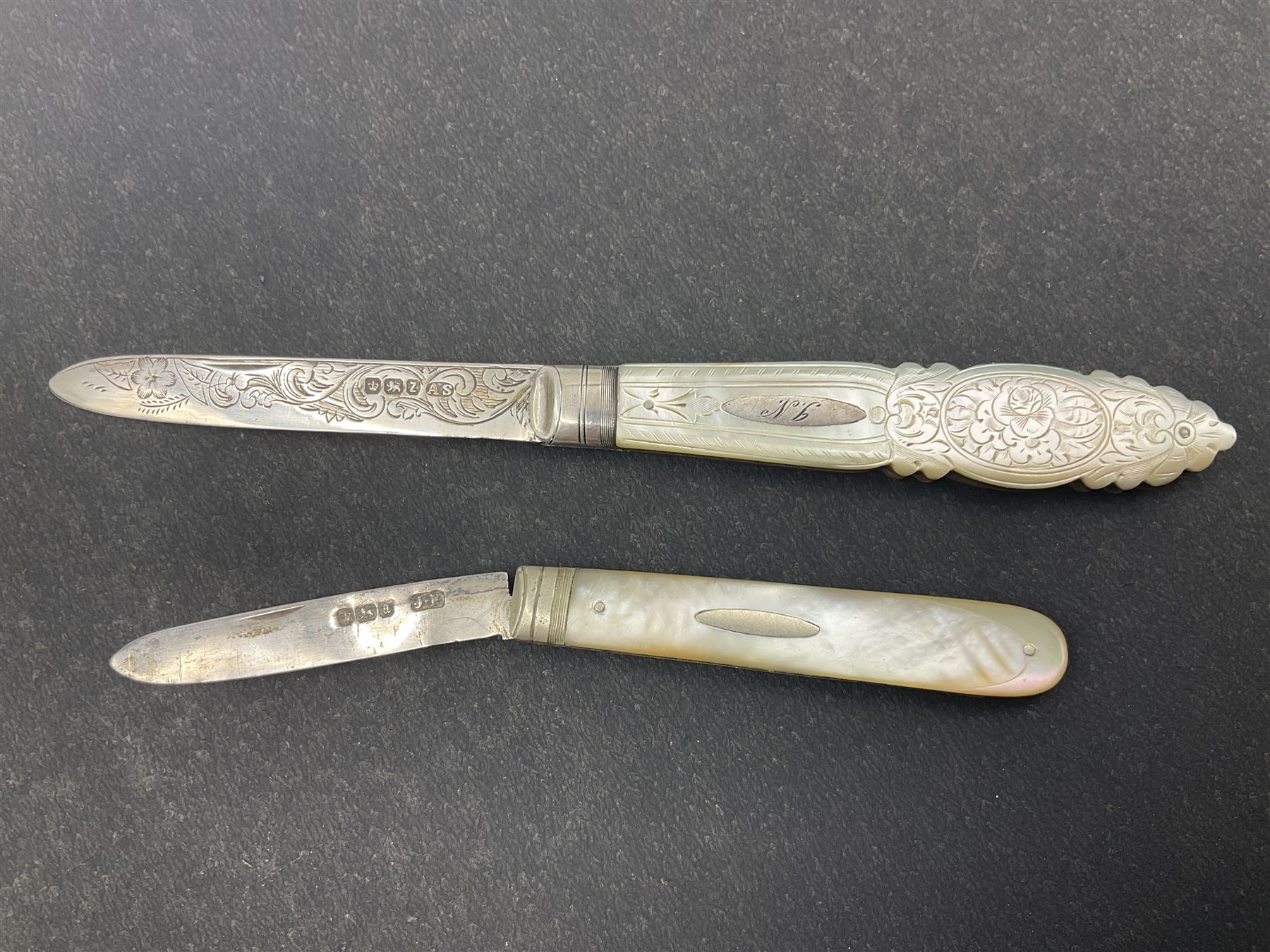 Two silver fruit knives with mother of pearl handles, hallmarked, mother of pearl tokens and similar items 