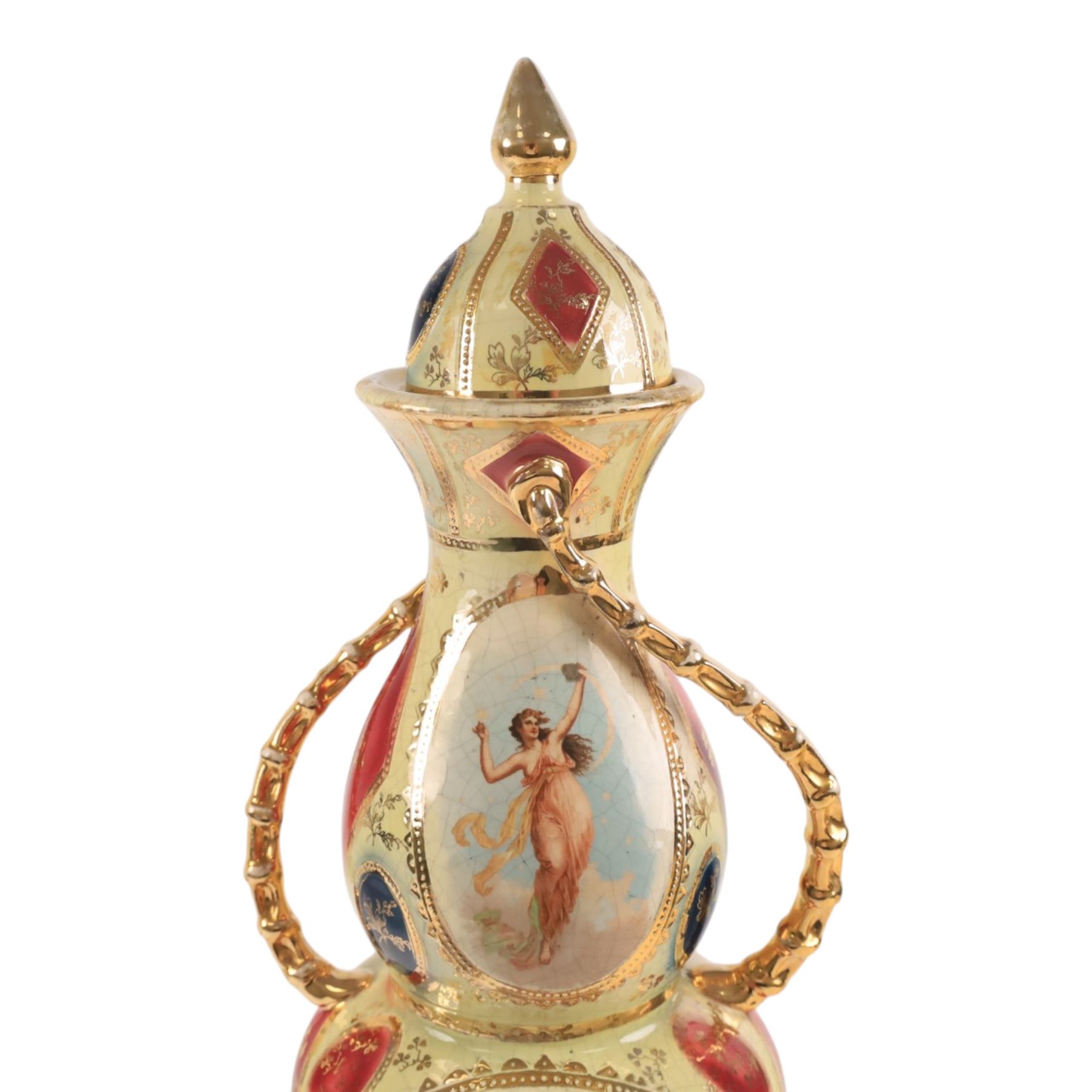 Large Royal Vienna covered urn, the central panels decorated with dancing figures and gilt detail, with twisted handles, H56cm