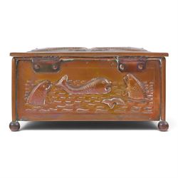 Art and Crafts copper and brass hammered casket, of rectangular form with repoussé decoration of dolphins, in the manner of  John Pearson, H10cm L19cm