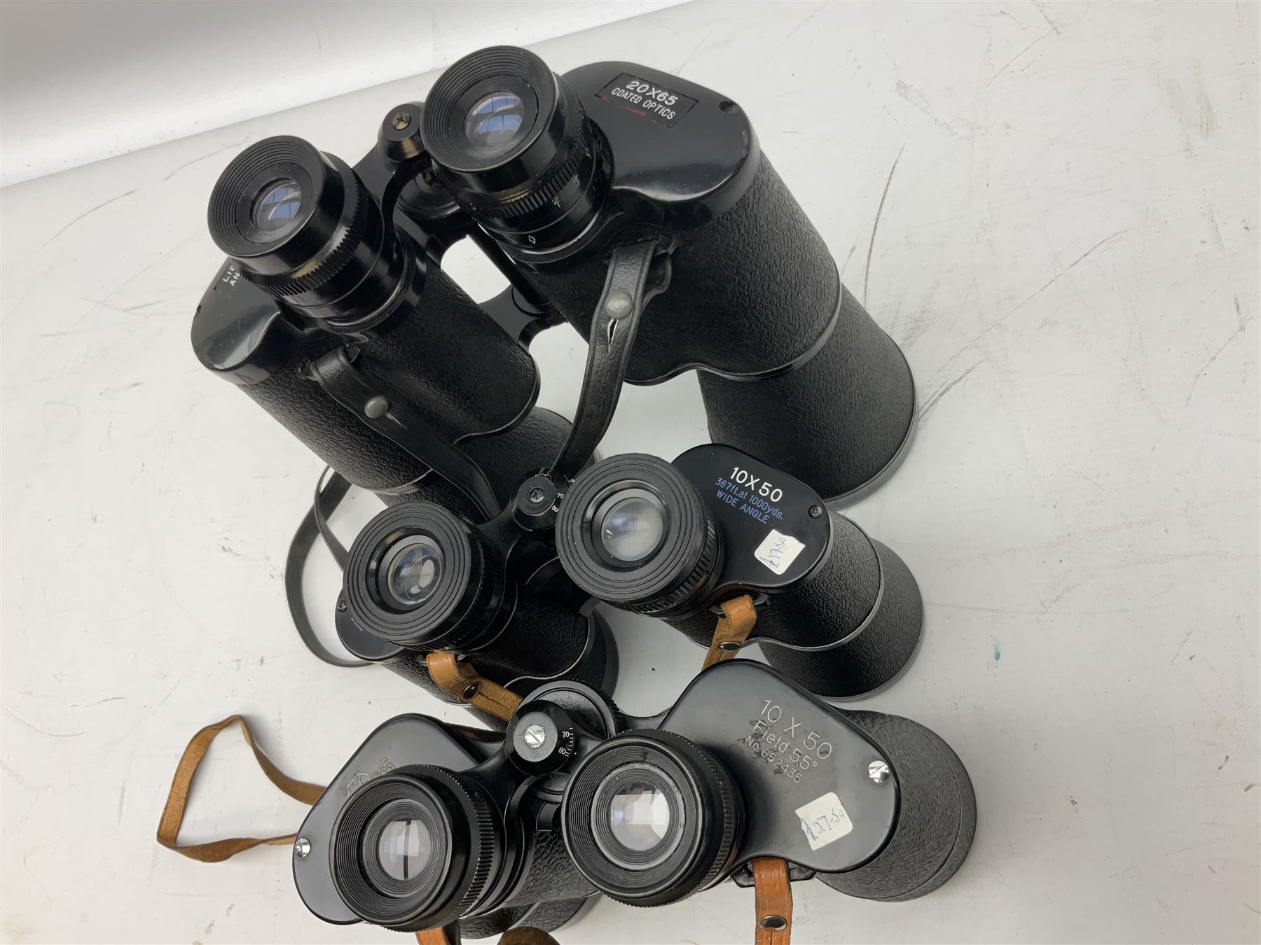 Eleven pairs of binoculars to include Lieberman & Gortz 20x65, Stem (USSR) 7x50, Helios 10x50 Field, Prinz 12x50, Tasco 8x40, Tasco 10x50, etc