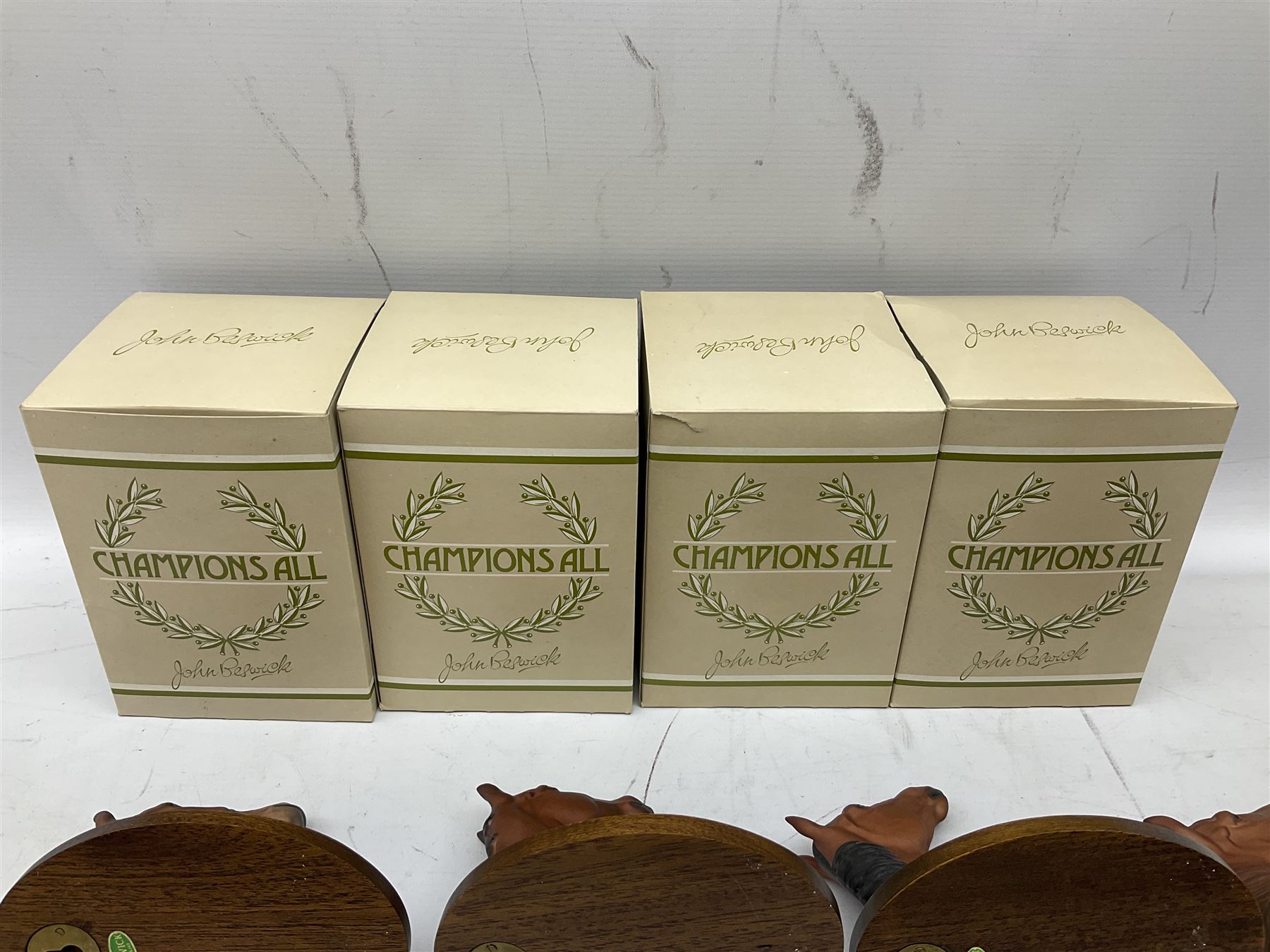 Beswick set of horse head wall plaques 'Champions all', comprising Arkle no.2700, The Minstrel no.2701, Red Rum no.2702, Troy no.2699, all with original boxes