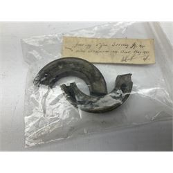 Small collection of WW2 shrapnel and German and British shell parts, most with manuscript details of where and when found including London, Leeds, Bristol, Linton-on-Ouse etc