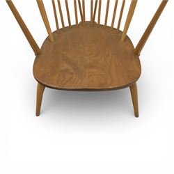 Ercol - Mid 20th century elm and beech Windsor armchair, the hooped spindle back over a shaped elm seat, with scroll front armrests on turned supports, raised on splayed tapering legs united by stretchers, lacking loose seat cushion