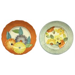 Two 1930s Gray's Pottery plates, both painted with flowers in orange, blue, yellow and green colourway, D27cm