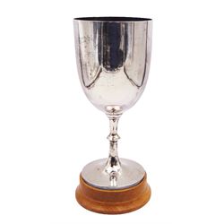 1920s silver trophy cup, of plain form, upon knopped stem and circular spreading foot, body with worn presentation engraving, hallmarked Francis Howard Ltd, Sheffield 1921, upon wooden base, including base H27.5cm