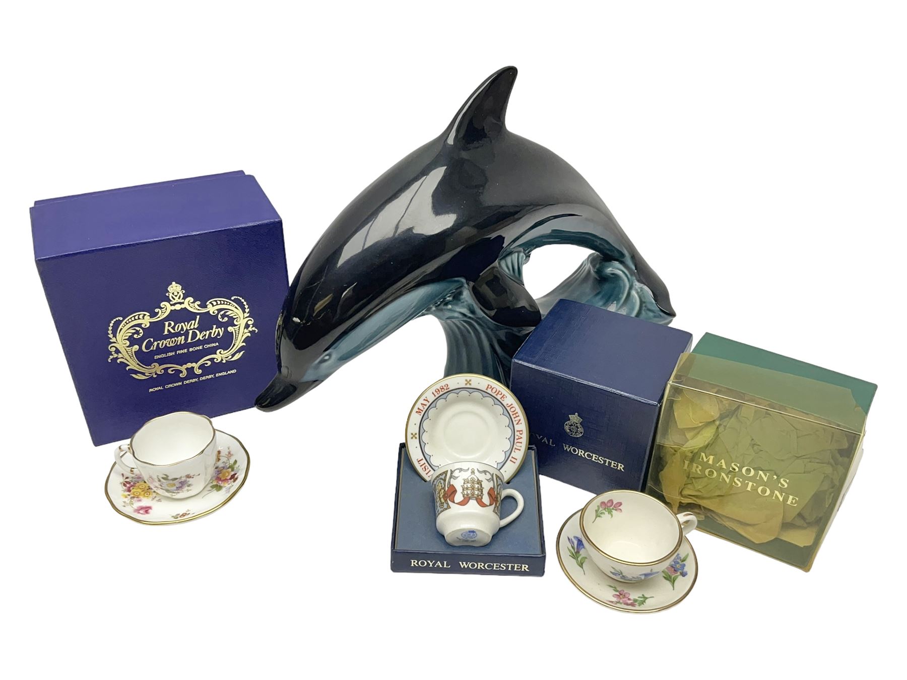 Poole pottery Dolphin, together with Royal Worcester miniature teacup and saucer, Royal Crown Derby miniature teacup and saucer in Derby Posies and one other