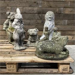 Various cast stone and composite garden ornaments, to include Peter Rabbit, goose, pigs, dogs, dog with wheelbarrow, painted metal bird bath and other, on two pallets