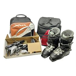 Three sets of Salomon ski boots (two as new), together with associated clamps