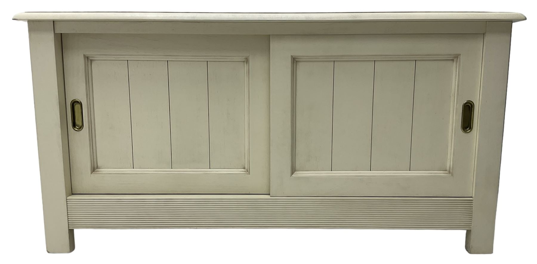 Cream finish low side cabinet, moulded rectangular top over two sliding panelled doors, on stile supports 