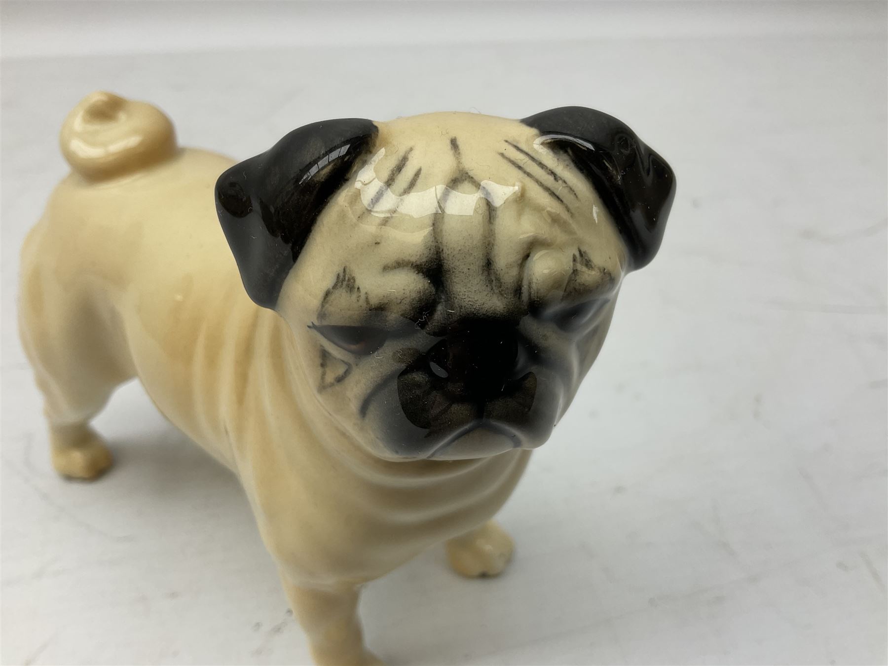 Three Beswick models comprising Hereford Bull no 949, 'CH Cutmil Cupie' Pug, and bay Shire horse, all with printed marks beneath