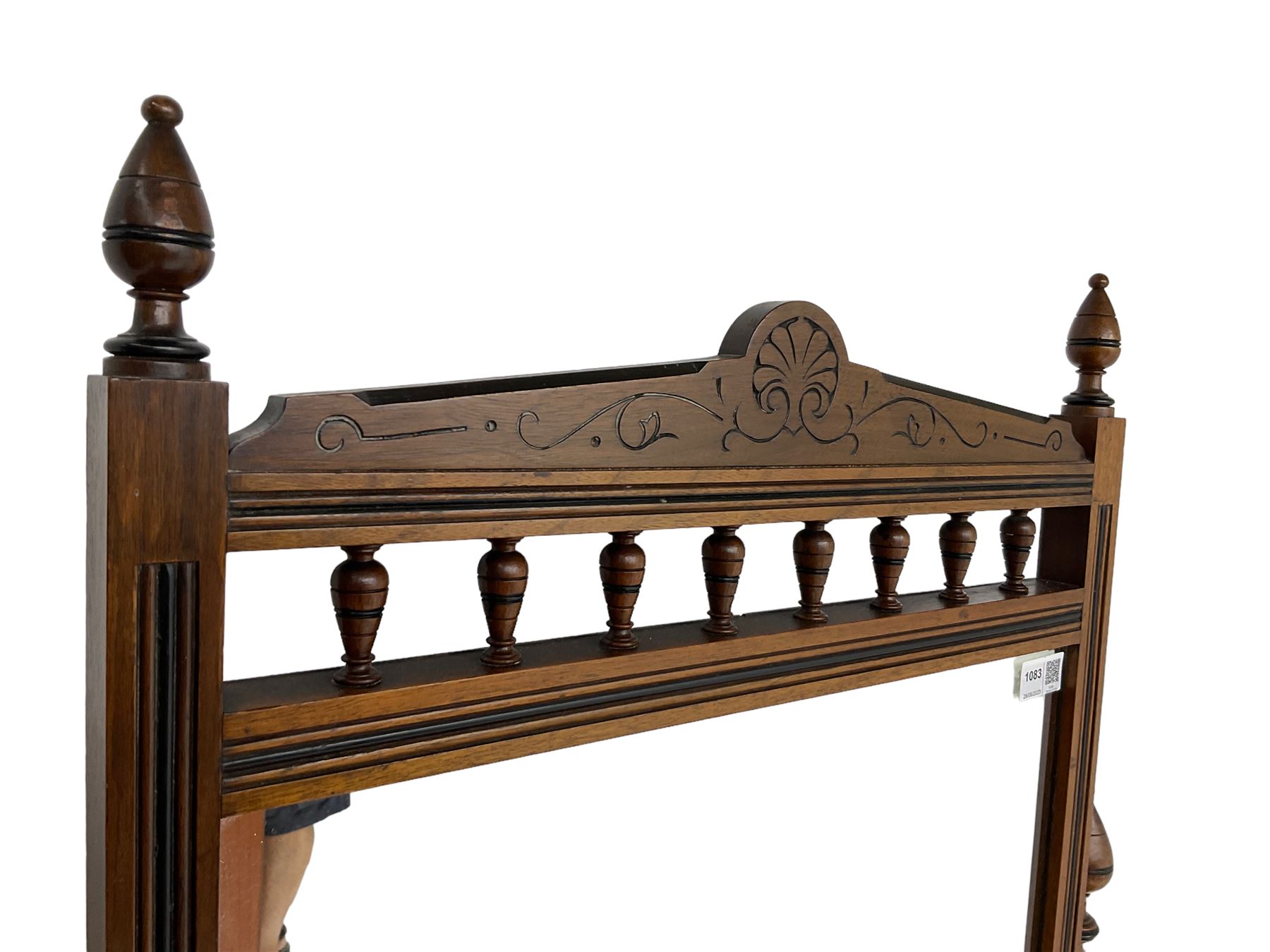 Late Victorian Aesthetic Movement walnut and inlaid ebony dressing table, swing mirror back with shell carving and spindle support rail, fitted with two trinket drawers and single frieze drawer, raised on ring turned supports with castors