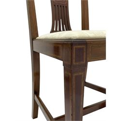 Set twelve (4+8) Edwardian inlaid mahogany dining chairs, cresting rail with satinwood banding, pierced splat backs with central inlay, drop-in seats upholstered in foliate patterned ivory fabric, raised on square tapering supports terminating in spade feet