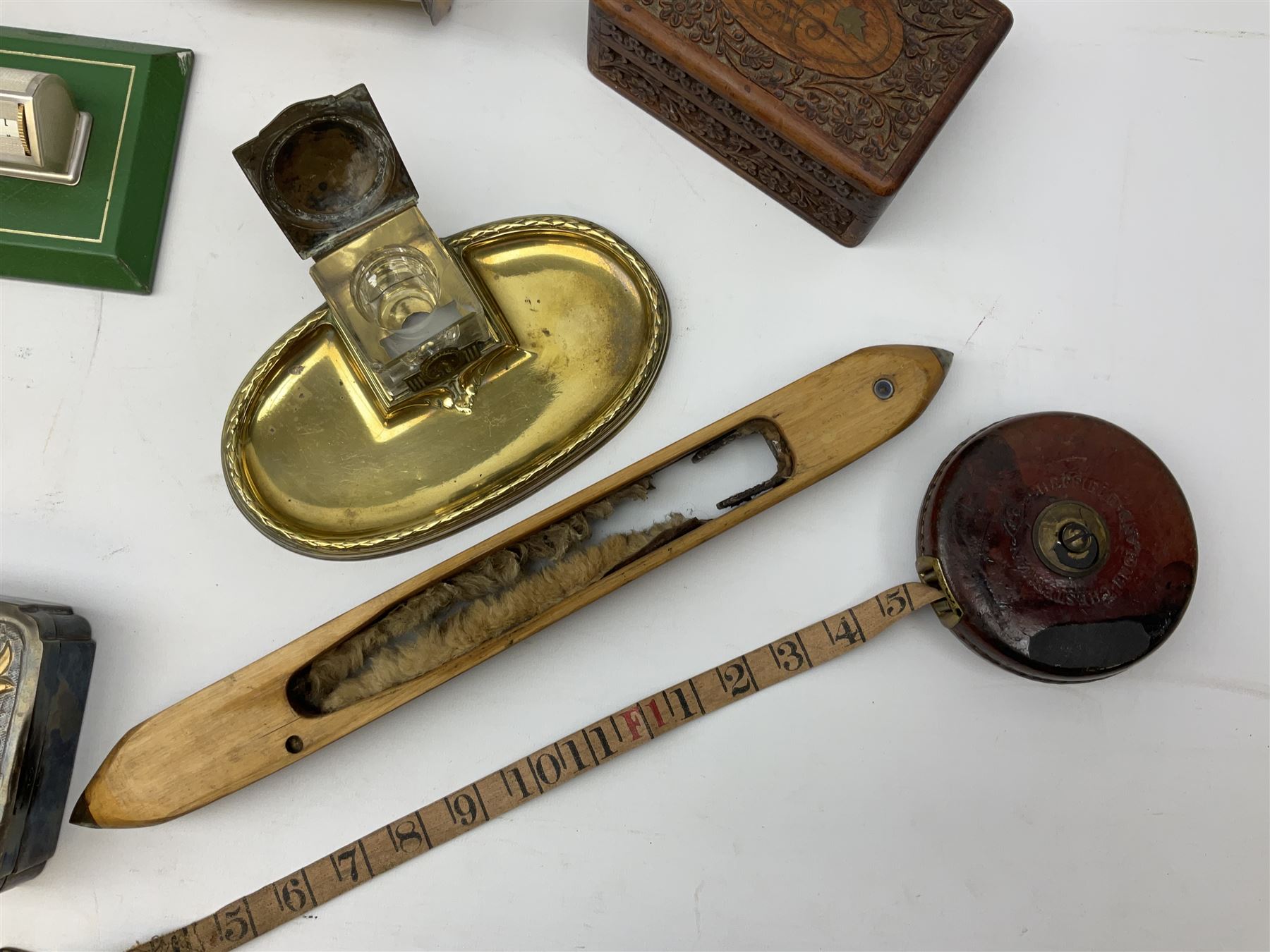 Olive wood lidded urn/vase, brass inkwell, Art Deco style perpetual desk calendar, leather bound Chesterman tape measure, brass roasting spit, Punch Magazines etc