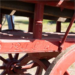 Costermonger’s Cart

A painted costermonger’s cart with red timber frame, slatted deck and wooden spoked wheels. The cart has long hand rails, raised side rails and turned supports, with incised inscriptions to the frame, including “Meyers Bros”. The form is consistent with a hand drawn market cart, used for carrying and displaying produce or goods.

Features:
Red painted timber frame
Slatted wooden deck
Wooden spoked wheels
Long hand rails
Raised side rails
Turned timber supports
Incised inscriptions to the frame
“Meyers Bros” inscription visible
Traditional market cart form

Dimensions:
Length: 240 cm (body approximately 210 cm)
Width: 102 cm
Height: 92 cm

Wheel diameter: 67 cm