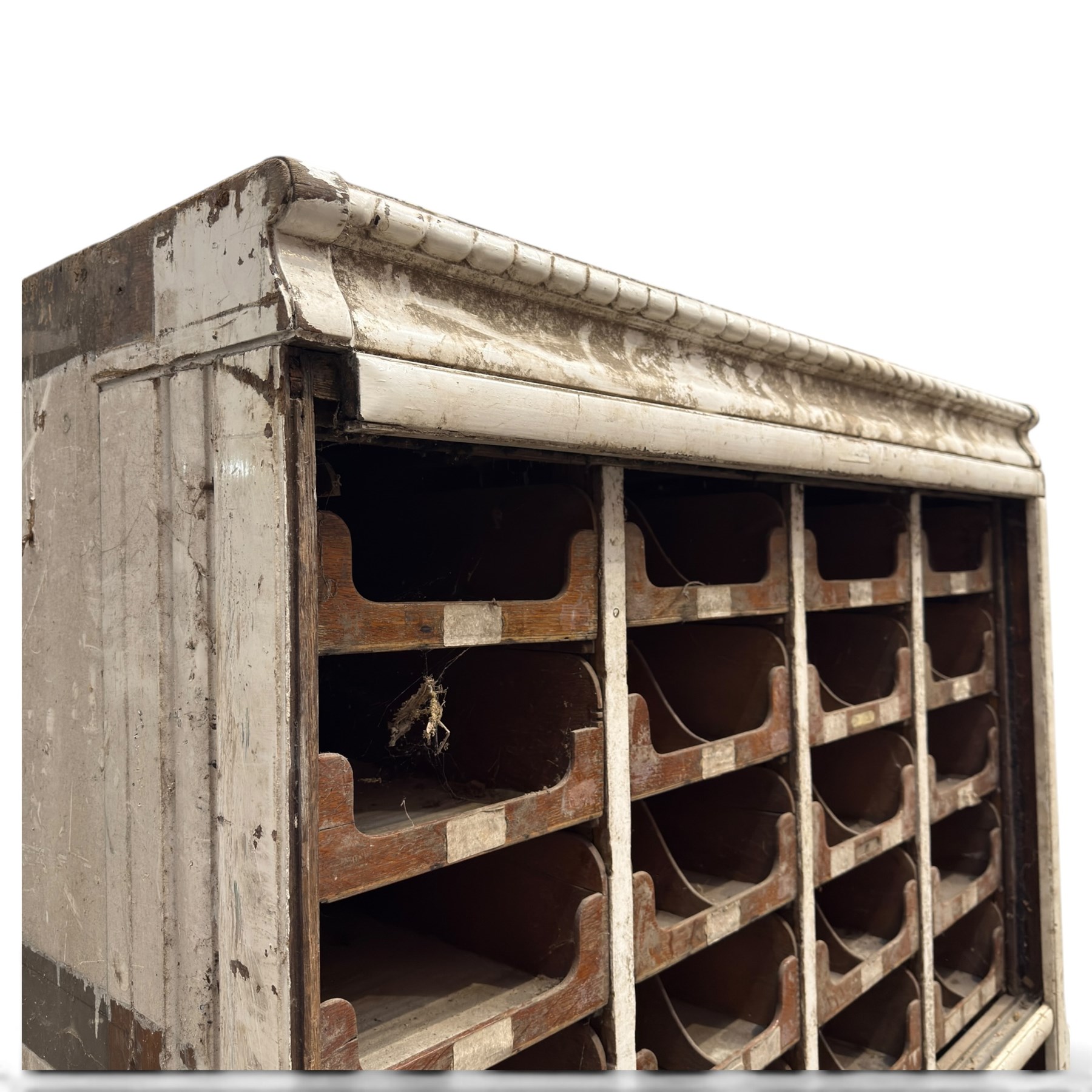 F Pollard & Co - late 19th century rustic haberdashery shop cabinet, fitted with an assortment of forty sliding trays, with drawers fitted to base, in antique white-painted finish