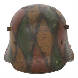 WWI German camouflage M16 helmet, with camouflage painted finish to the skull in green, brown and ochre colours with black separation lines
