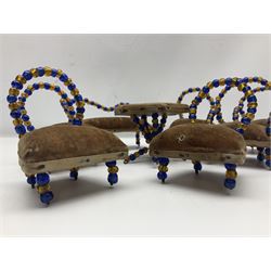 Quantity of early 20th century doll's house furniture comprising Victorian style beadwork and upholstered eight-piece salon suite; beadwork dining table with four matching chairs; and Kleeware brown plastic seven-piece dining suite