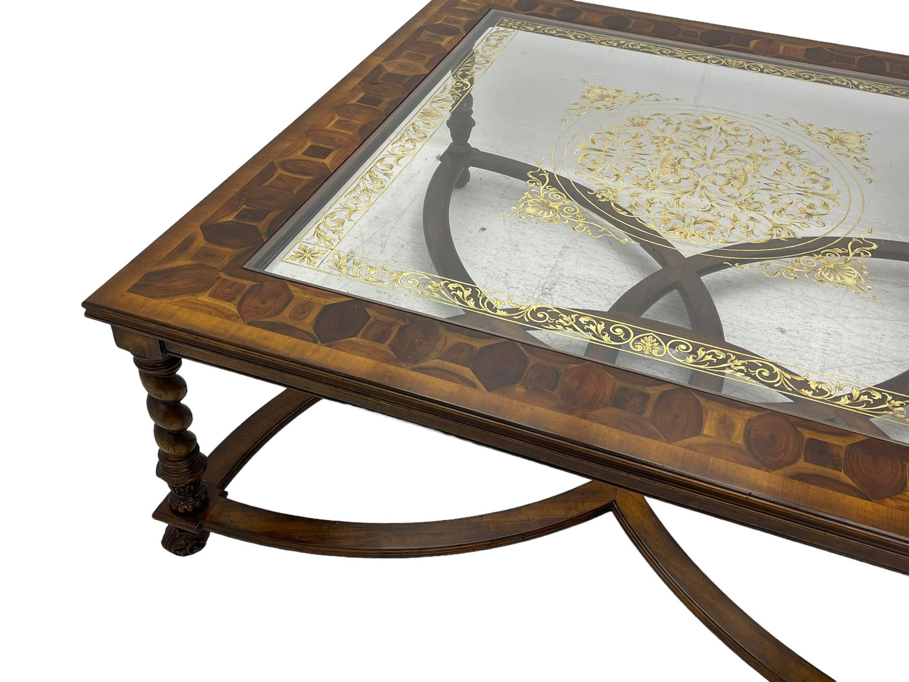 Jonathan Charles - large mahogany coffee table, the square oyster veneered top with verre églomisé inset, the glass hand-painted with gilt scrolling foliate patterns, raised on spiral turned supports with acanthus and gadroon carvings, united by interlocking demi-lune stretchers, on scrolled acanthus feet