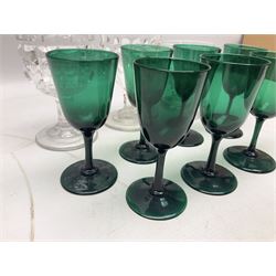 Seven 19th century green wine glasses, together with a rummer glass, the funnel bowl upon thick circular spreading foot with facet-cut decoration, and two moulded glasses, one with Victorian lozenge beneath