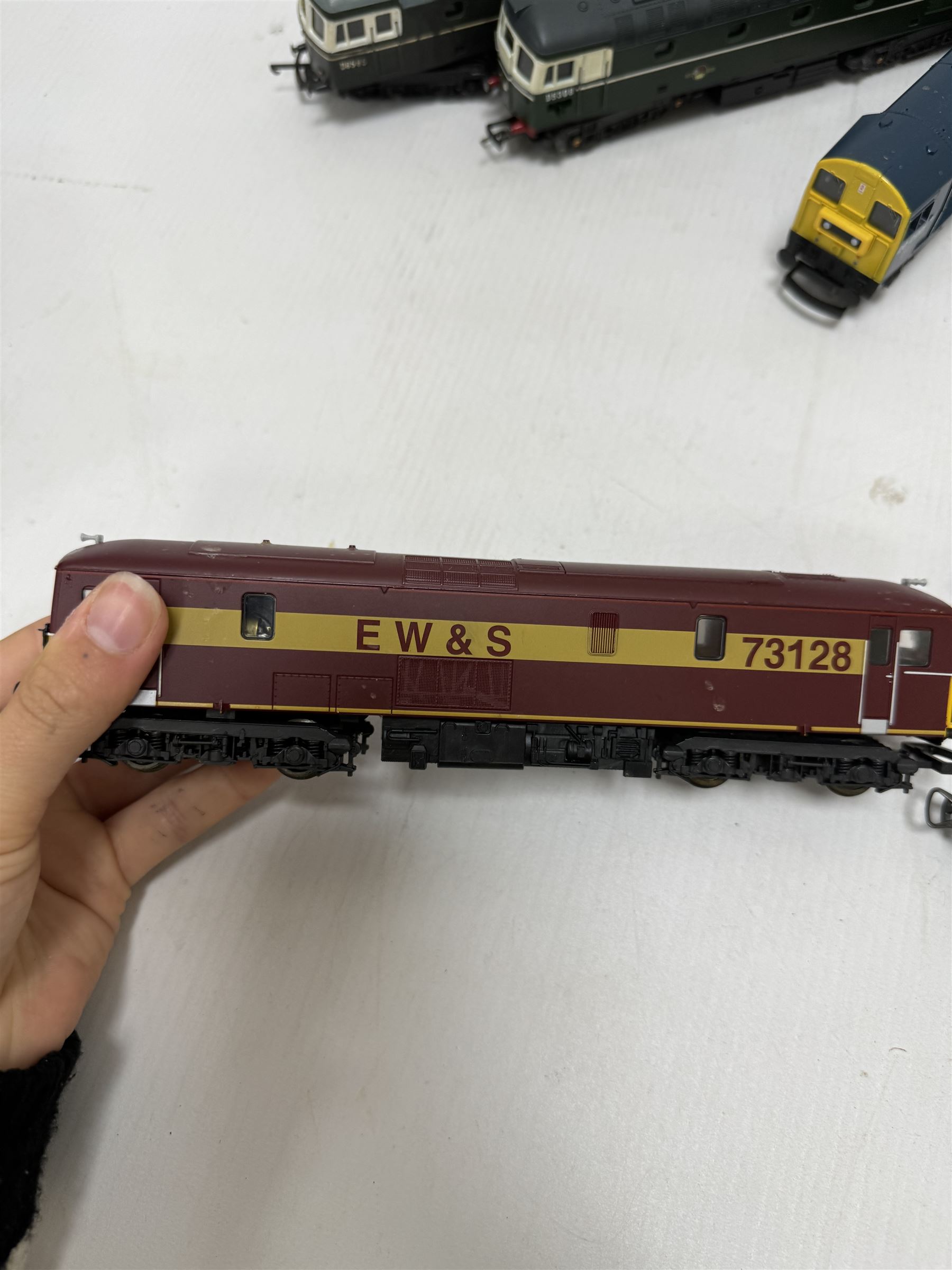 Eight Lima Ho and '00' gauge locomotives, comprising BR Class 20 locomotive no. 20222, re-worked BR Class 33 Bo-Bo locomotive no. D6585, Class 73 Bo-Bo Broadlands no. 73142, Class 73 Bo-Bo EWS locomotive no. 73128, 201640 Class BR no. 221 149-8 DB, Class 26 Bo-Bo locomotive no. D5308, Amtrak 523 diesel locomotive and Class 1400 2-4-0 no. 20215, unboxed