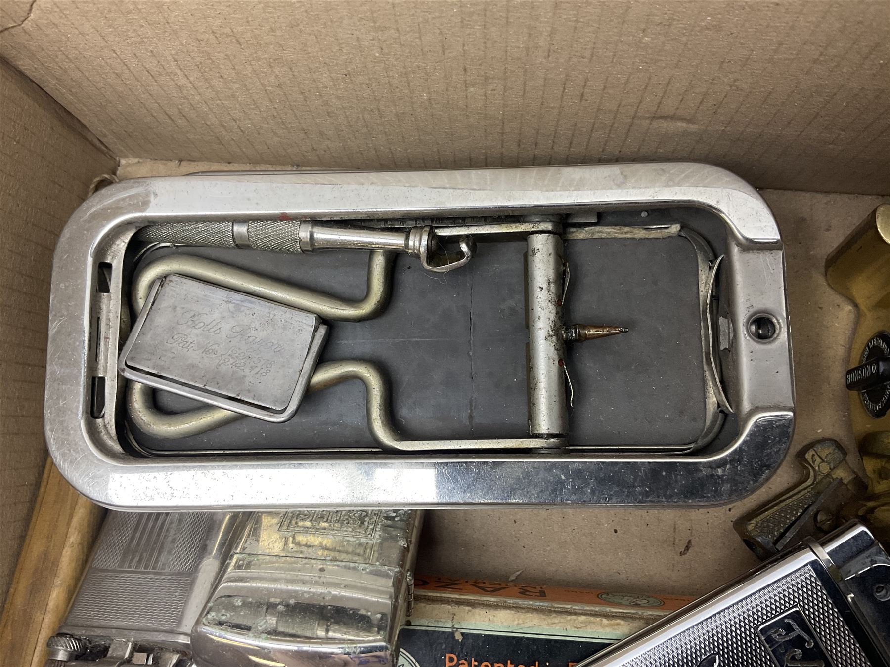 Collection of various razors and smoking items to include Ronson brass table lighter, Rolls Razor, Seigneur case with lighter, etc