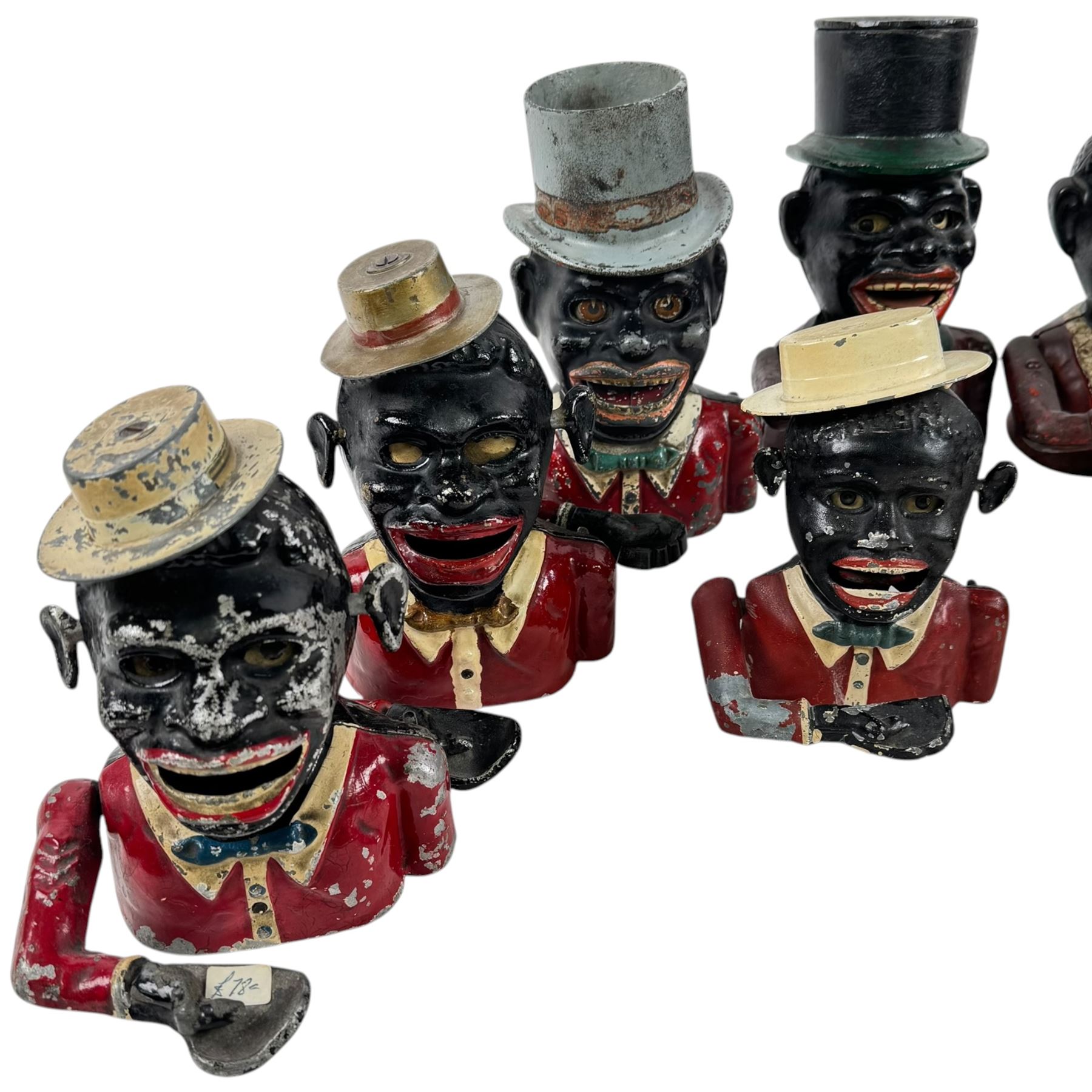 Collection of cast iron Jolly money boxes with and without hats