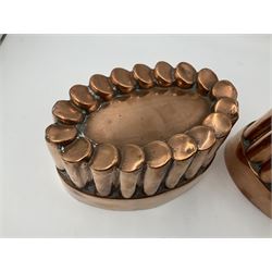 Five Victorian copper jelly mould, largest H10cm, L16cm