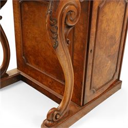 Victorian figured walnut Davenport, the fixed fall with drawer to the side enclosing writing compartment, green tooled leather writing inset, galleried back rail, right side fitted with four drawers behind a panel, opposing panelled side, raised on carved cabriole front supports with scroll terminals and platform base