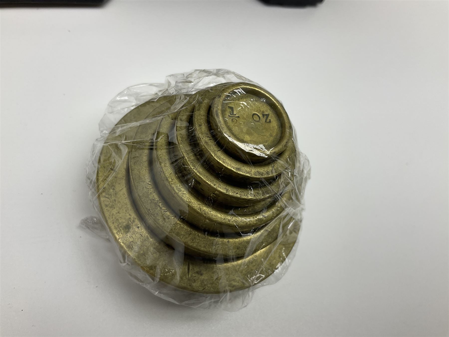 Black painted and brass kitchen balance scales with graduated set of brass weights