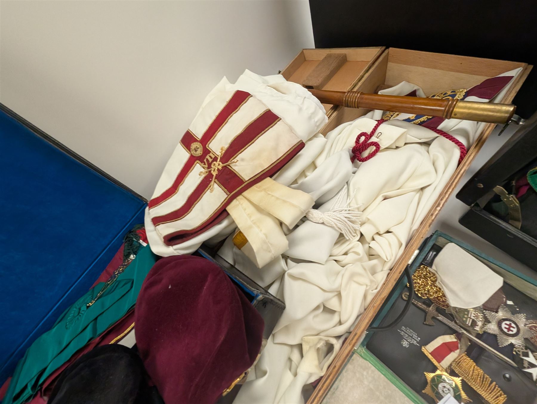 Collection of Masonic jewels and regalia, including robes, sashes, gloves, medallions, etc, in a number of briefcases and boxes