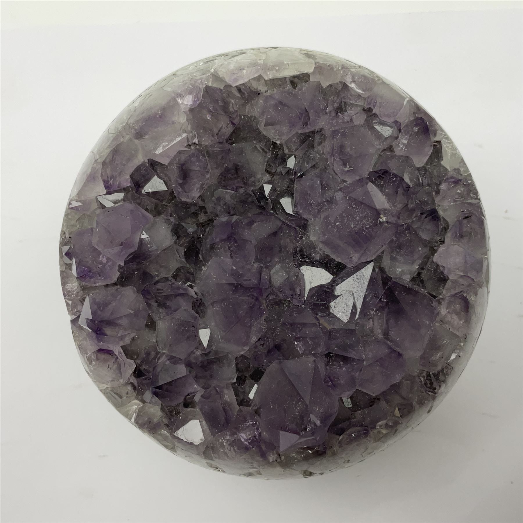 Pair of amethyst geode spheres, with purple crystalline internal formations, D9cm