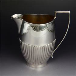 1920s silver jug, of oval part fluted form with angular handle, hallmarked Joseph Gloster ...