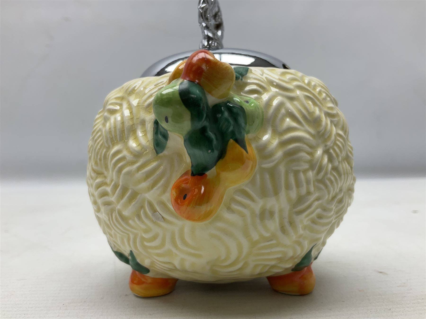 Clarice Cliff Celtic Harvest pattern sugar bowl, with original silver plate cover upon basket weave effect spherical body decorated with raised stylised fruit, H11cm